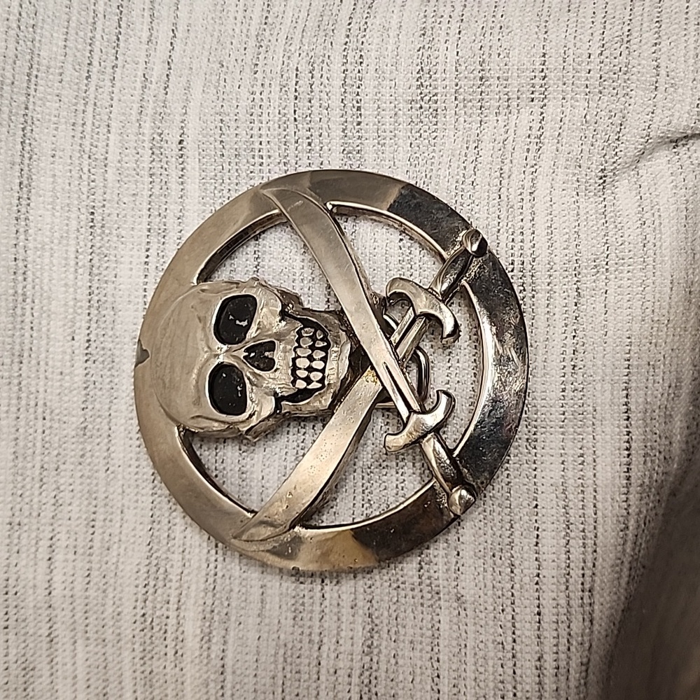 Skull and crossed swords belt buckle by Silver Star.